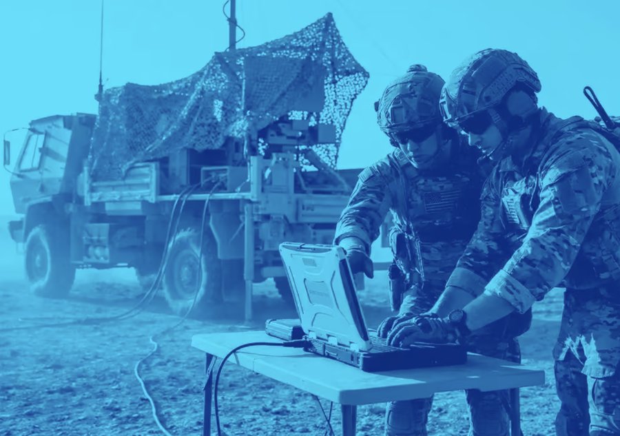 Soldiers operating a Spectara biosecurity detection system in the field